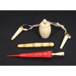 Four 19th Century ivory pieces comprising a pair of Palais Royal style knitting needle protectors,