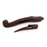 Two 19th Century knitting sticks comprising a mahogany scroll end example carved with diamonds and