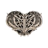 A two part silver buckle of heart form pierced and cast with sinuous flowering branches, leaves