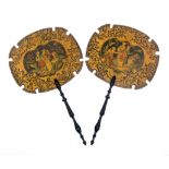 A pair of Regency penwork face screens of shaped border oval form each with a colour panel of