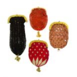 Four small format 19th Century knitted purses all with fancy gilt clasps and base ornamentation,