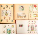 Victorian and later scraps, cards and prints, neatly arranged in four albums, largest, 28.5 x