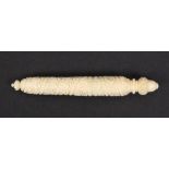 A 19th Century ivory needle case of cylinder form spiral carved with leaves, acorn finial, 10.2cm