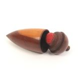 An early 19th Century fruitwood pin poppet/thimble case of turned tapering form, 7.5cm