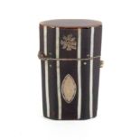 A Georgian tortoiseshell small etui of octagonal section with ivory lines, silver florets and oval