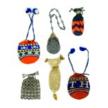 Six 19th Century small format purses, knitted or crochet, comprising a drawstring pair one