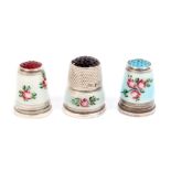 Three pretty white metal and floral enamel thimbles each with inset stone top, all stamped '925' (