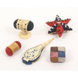Five pin cushions comprising a patchwork square, 2.2cm, another of star form, 5cm, another in cut