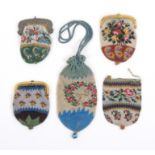 Five small format 19th Century beadwork purses comprising two floral examples and a geometric