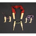 Four pairs of bone knitting needle protectors, all with ribbons comprising two pairs as boots, a