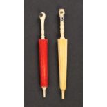 Two 19th Century ivory furled umbrella needle cases one-part red stained with Stanhope (two