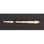 A 19th Century ivory tambour hook, well carved, steel turnbuckle, complete with hook, 12cm