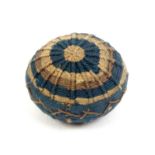 An 18th Century knitted pin ball in ribbed radiating circles of blue/green/brown and fawn,