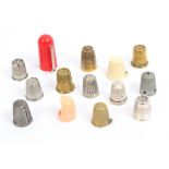 Fourteen 20th Century gadget type thimbles mostly brass, nickel and plastic but including a silver