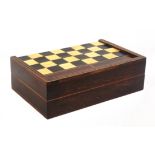 An early 19th Century rosewood folding chess/back gammon board in ivory and ebony squares one