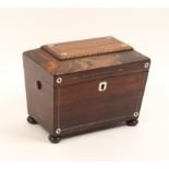 A mid Victorian rosewood sarcophagal form tea caddy with mother of pearl dots and pewter lines,