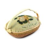 An attractive pin stuck and painted pin cushion in the form of a basket the velvet pad pin stuck '