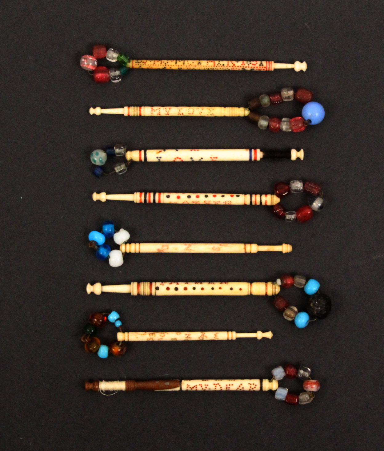 Eight spot inscribed bone lace bobbins comprising - Love Me/My Love - Love Me/My Dear Mother/My Dear