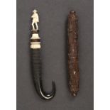 Two needle cases comprising a Black Forest example in horn below an antler mount finely carved