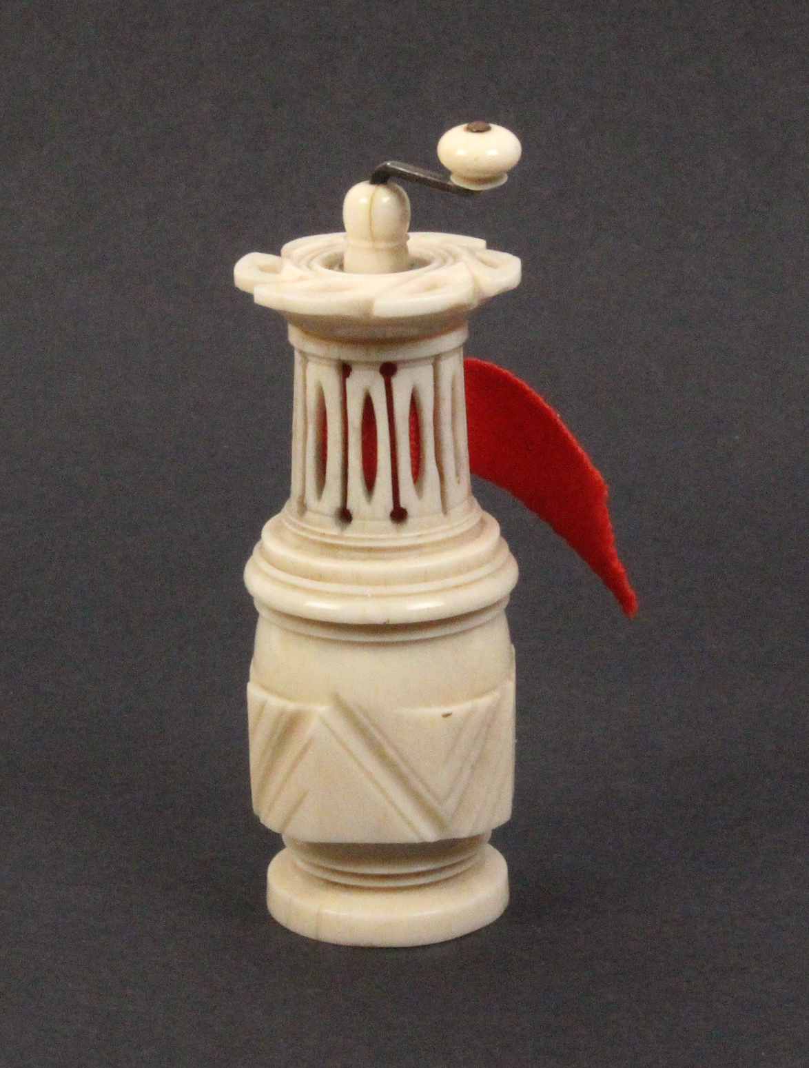 An unusual 19th Century ivory tape measure in the form of a cylinder coffee grinder, replacement