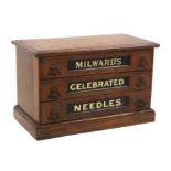 A Victorian three drawer walnut counter cabinet each drawer with inset green glass panel titled in