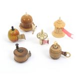 Five tape measures comprising a painted wooden apple, worn printed tape in ins., 4cm, a box wood