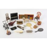 A group of dolls house accessories including a metal piano, 7.2cm, a folding metal pram, miniature