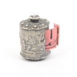 A scarce silver pictorial tape measure of cylinder form depicting the gate house of Kenilworth