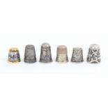 Six thimbles comprising two white metal niello examples, and four others including a steel