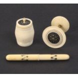 Three 19th Century ivory sewing tools comprising a cylinder needle case with burnt circle