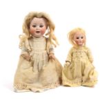 Two dolls both with porcelain heads, the first with open mouth stamped 'PM/914/0' composition body