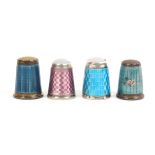 Four continental enamel thimbles comprising two with inset stone tops the pink enamel example