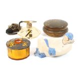 Four vintage dressing table accoutrements comprising a glass powder jar, internal paper label 'Le