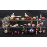 A collection of glass and other vintage Christmas tree ornaments including an anchor, fish, bird,