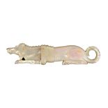 A Palais Royal mother of pearl needle case in the form of a poodle at rest, curled tail, small