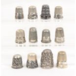 Twelve white metal and silver thimbles 20th Century, including American examples and heavy example