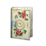 A painted bone combination needle book and pin cushion brightly painted with flowers, roundels to