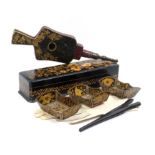 A Victorian pen work glove box and four Regency penwork pieces, the rectangular box with zig zag