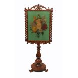 A Victorian fire screen the painted floral panel on velvet within a pale mahogany frame with leaf
