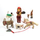 Clockwork toys comprising a 'fur' covered mule 14.5cm, a horse, 20cm, a dog, 11cm, a bull, 12cm, a