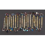 Twenty one bone lace bobbins including examples bound with brass wire, pewter, beads and others (
