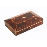 A tortoiseshell etui of rectangular form, circa 1840, with a full compliment of tools, the curved