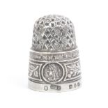 A silver commemorative thimble, Queen Victoria's diamond jubilee 1897, two neat holes to apex,