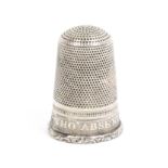 An early 19th Century silver thimble, the frieze inscribed 'The Absent Ever Dear', on a ribbed