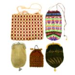 Five knitted or knotted small format 19th Century purses, one with steel clasp, one fancy gilt,