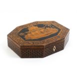 A Regency penwork card box of octagonal form the sides in trellis florets, the lid with a