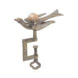 A brass hemming bird clamp, rectangular floral frame the sprung bird with pin cushion and Patent