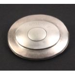 A silver oval pocket snuff box, the hinged lid engraved 'M. Baxter' over a vacant oval centre