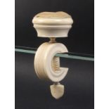 A 19th Century large ivory sewing clamp the 'C' frame below a circular pin cushion and box top, s.d.