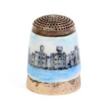 A silver and enamel thimble attributed to Peter Swingler depicting Caernarfon Castle for the
